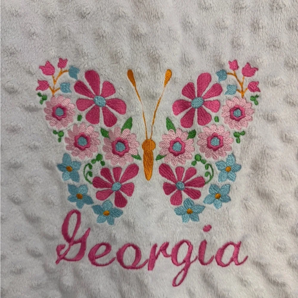 Floral Butterfly Baby Blanket with Georgia on it